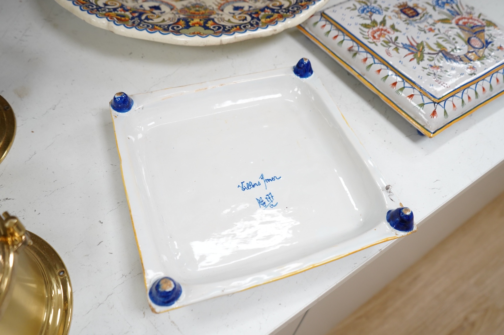 Four various late 19th century French faience dishes/stands, including a Nevers canted rectangular meat dish, largest 46cm wide